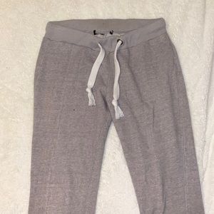 Gray sweats with small pockets on back and white strings
